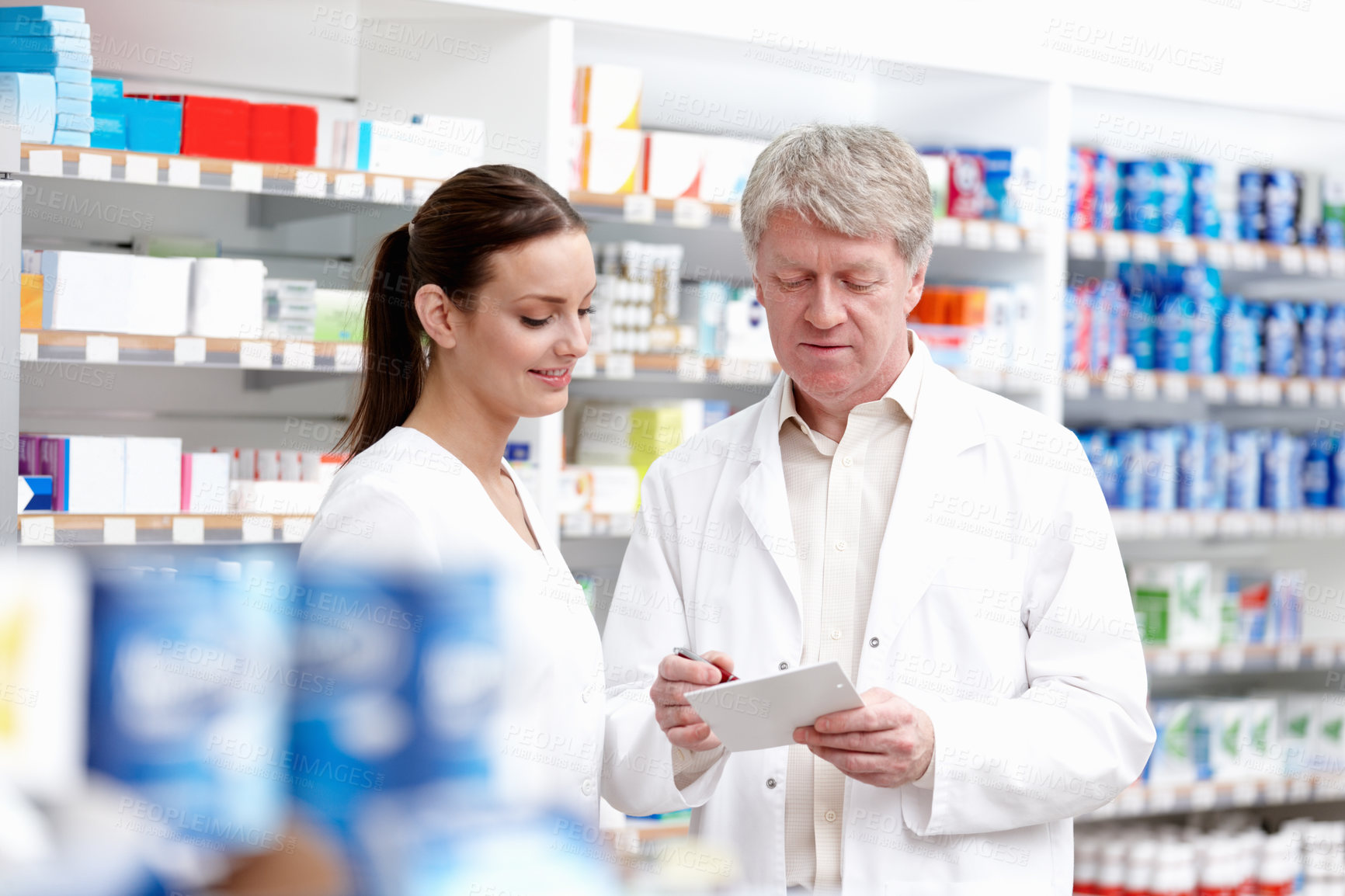 Buy stock photo Portrait of medical colleagues checking the medical prescription at store