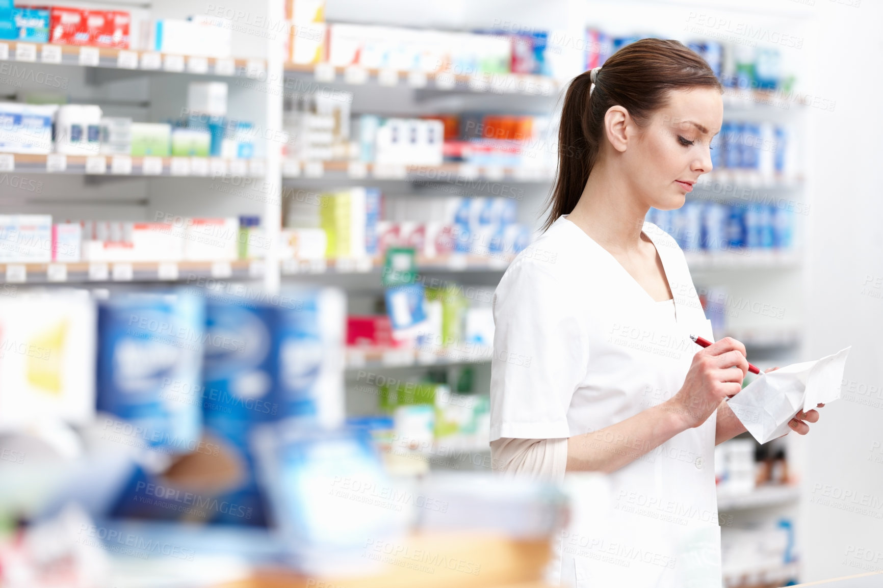 Buy stock photo Pharmacist, sales and pills in wellness, stock or medicine as drugstore, chemist or pharmacy. Medical professional, female person and reading for prescription or info in dispensary for advice or help