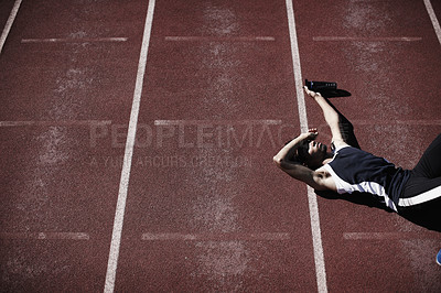 Buy stock photo Athlete, man and tired on race track with resting for sprint, running practice or marathon competition. Sport, person and exhausted on field for break, burnout ot water bottle for hydration or thirst