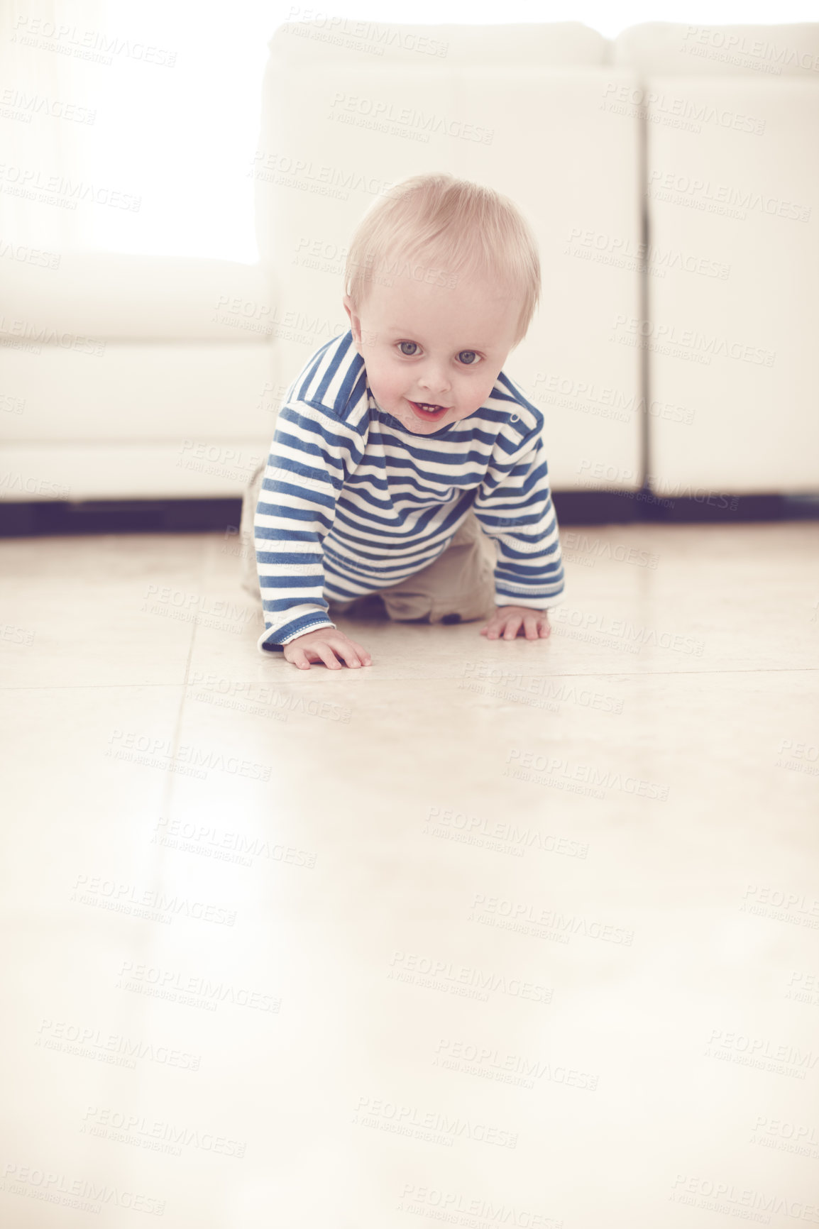 Buy stock photo A cute baby boy crawling on the floor at home