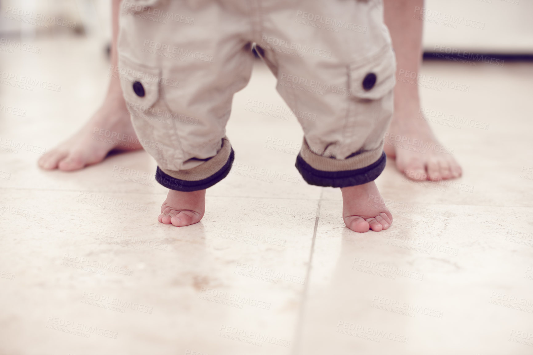 Buy stock photo Cropped view of a baby boy learning to walk 