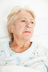 Despairing senior woman looks to the past - Senior Health/Illness