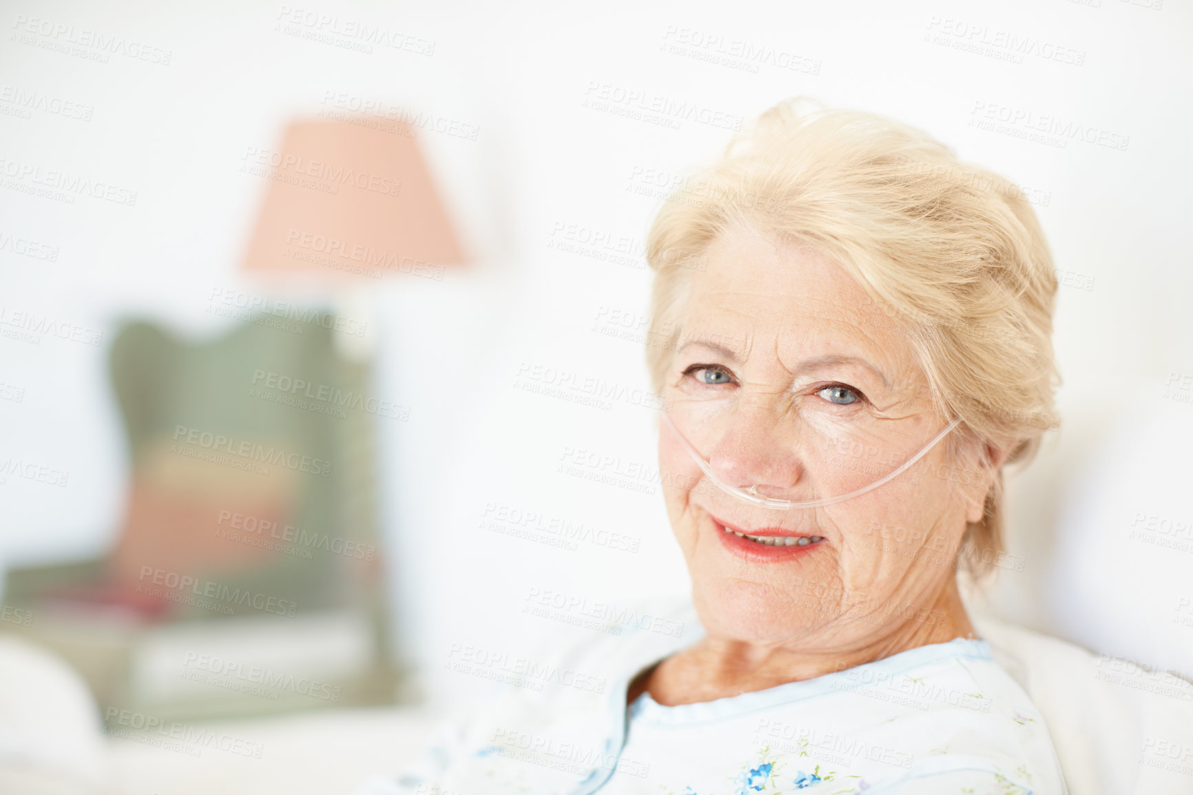 Buy stock photo Bed, woman and portrait with oxygen tube for recovery, healing and medical service for healthcare. Retirement home, female person and senior patient with ventilation for pneumonia, asthma or wellness