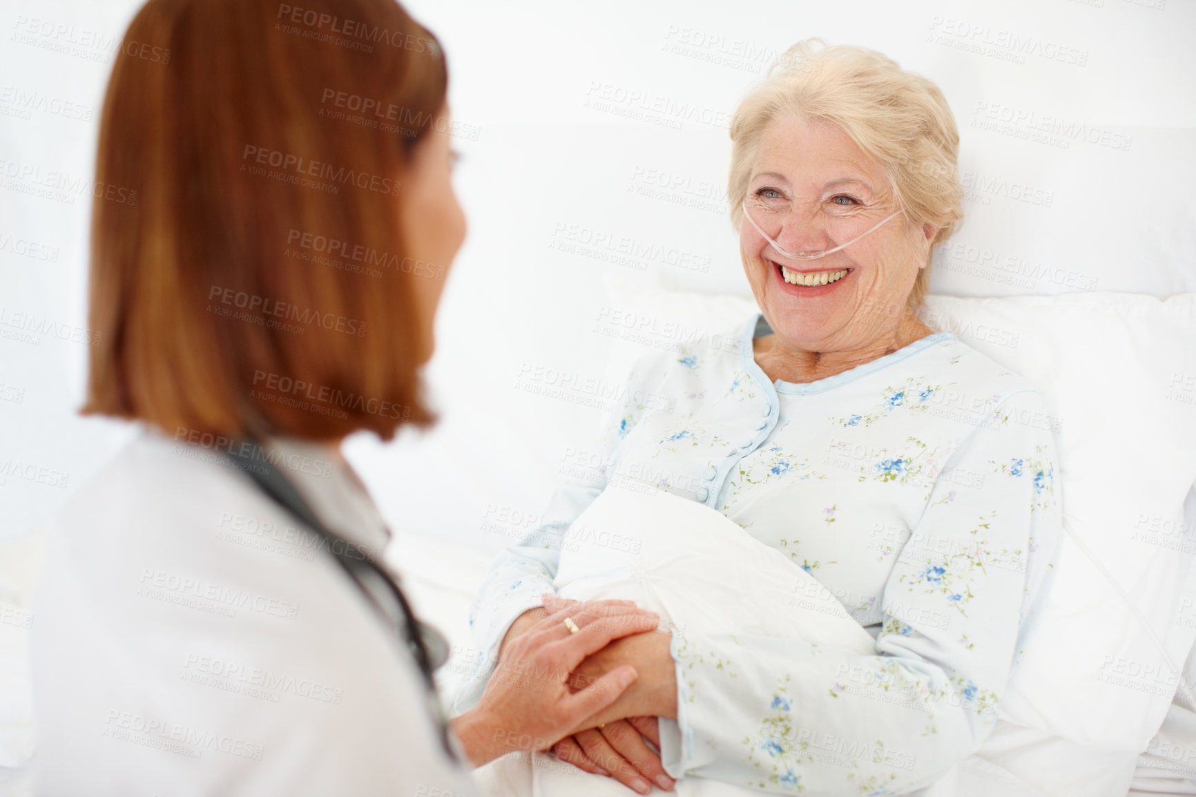 Buy stock photo Hospital, senior woman and doctor with holding hands for support, compassion and consultation in bed. Health care, elderly patient and caregiver with oxygen tube for pneumonia, asthma and recovery