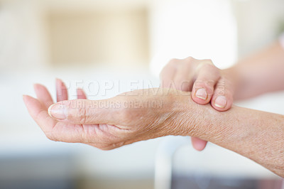 Buy stock photo Elderly, woman and hands checking pulse for circulation, hypertension and healthcare in nursing home. Retirement, care and senior person with wrist test for heart beat, blood pressure or wellness. 