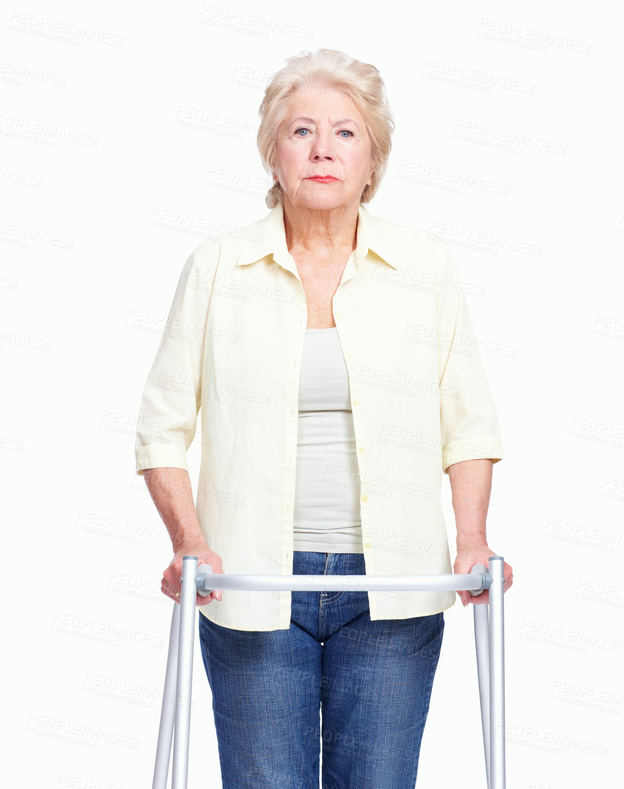 Buy stock photo Portrait of a serious elderly woman holding her zimmer frame while isolated on white