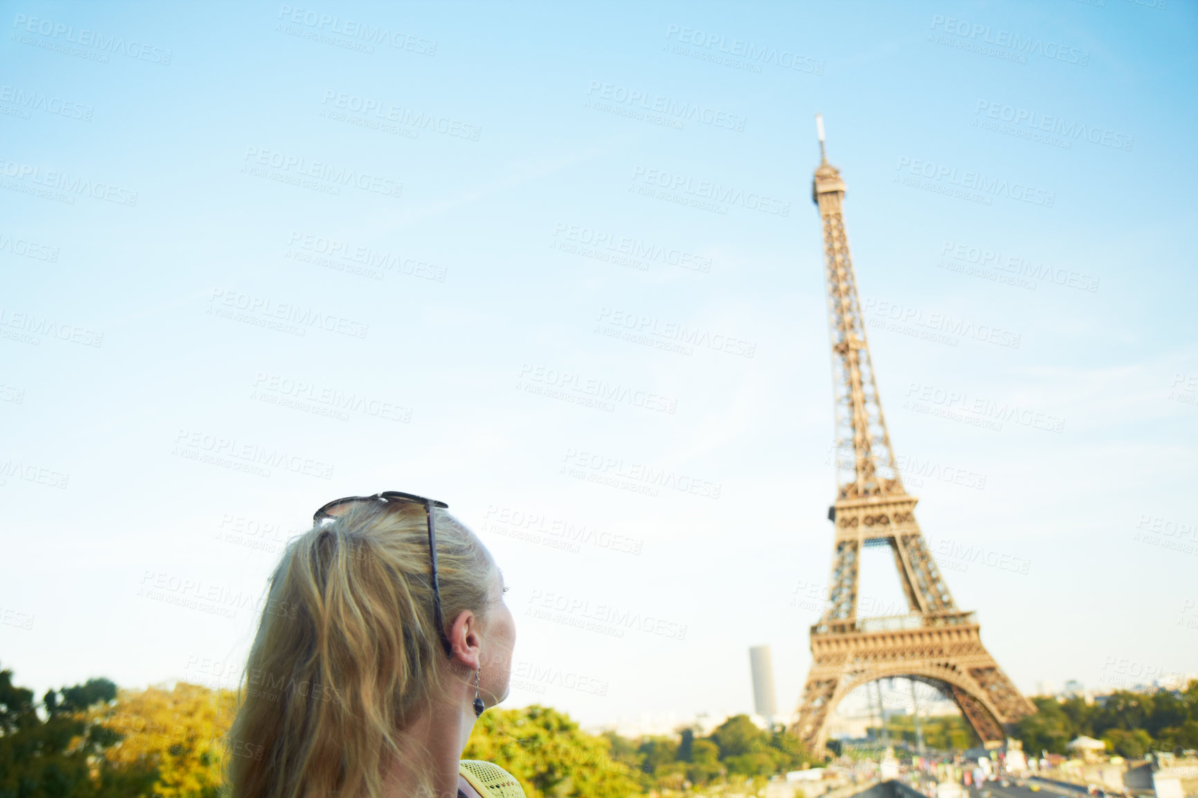 Buy stock photo Woman, outdoor and travel to Paris for holiday, tourist explore and sightseeing landmark on trip. Female person, thinking and weekend for reflection in city, urban location and dream of eiffel tower