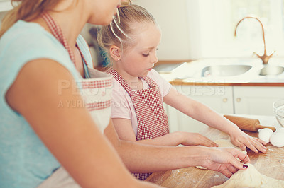 Buy stock photo Kitchen, kid and mom with help baking for teaching, learning and morning bonding together for lunch. Love, mother and daughter with rolling pin, ingredients and cookie recipe in home with child baker