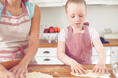 Buy stock photo Mom, girl and hands with dough in kitchen, preparation and teaching child skills in home. Mama, daughter and love for helping with cookies, cooking wheat and kid learning to bake cake or pastry