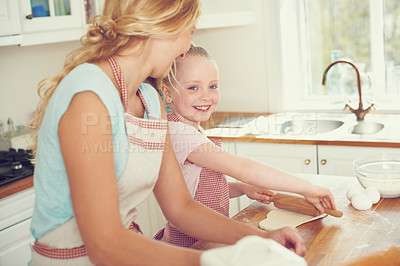 Buy stock photo Home, child and mom with help baking for teaching, learning and happy bonding together for lunch. Love, mother and daughter with rolling pin, ingredients and cookie recipe in kitchen with kid baker