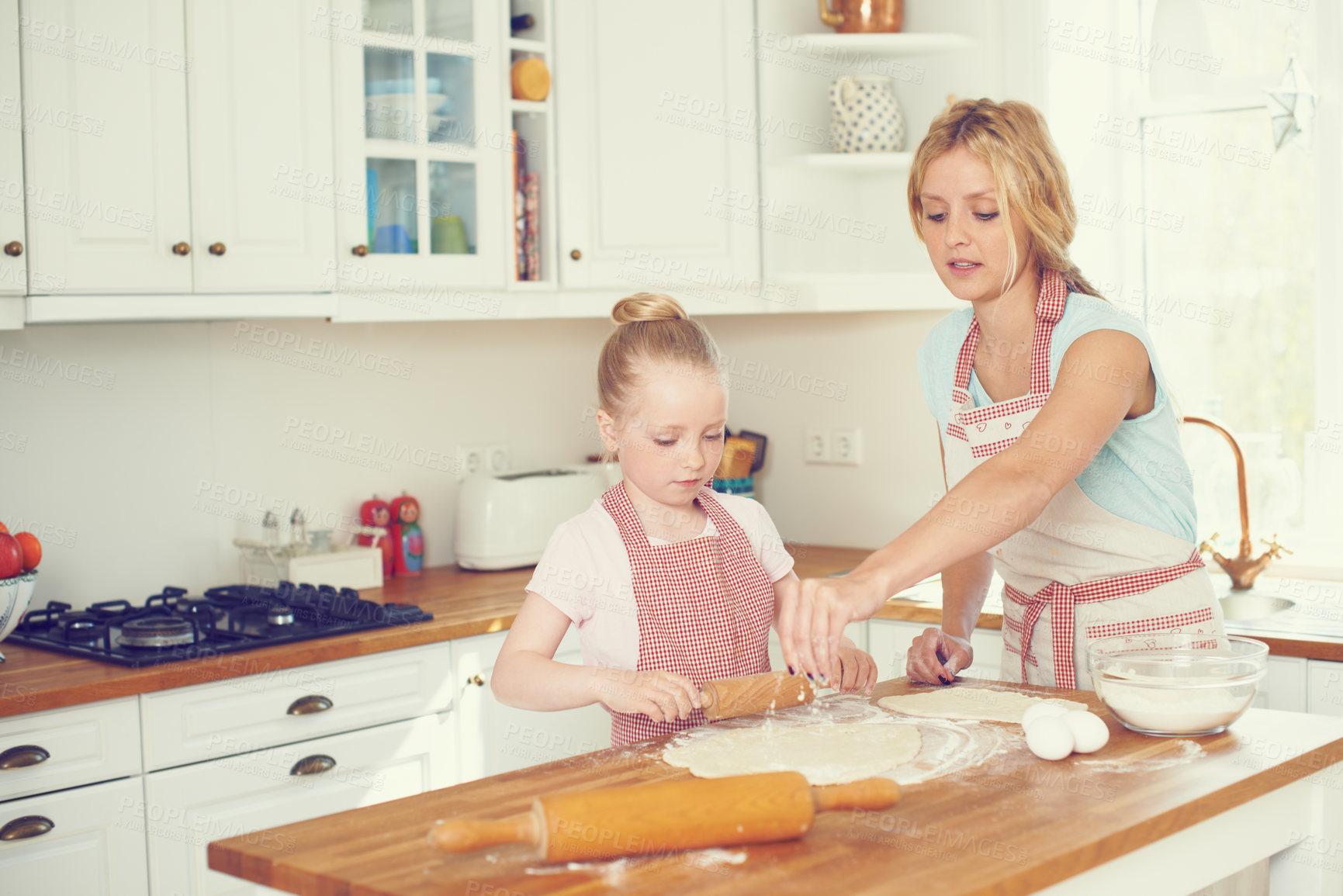 Buy stock photo Kitchen, child and mom with dough for baking, learning and bonding together in help with lunch. Love, mother and daughter with flour, ingredients and cookie recipe in home teaching girl kid baker