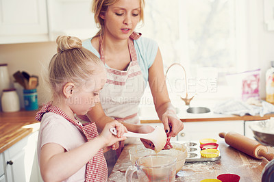 Buy stock photo Home, cupcake and girl helping mom baking with support, learning and morning bonding together. Love, mother and daughter with child development, ingredients and recipe mix in kitchen for kid baker