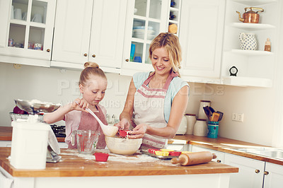 Buy stock photo Home, cupcake and kid helping mom baking with support, learning and morning bonding together. Love, mother and daughter with child development, ingredients and recipe mix in kitchen for girl baker