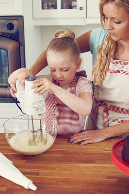 Buy stock photo Baking, cake and helping with mother and child in kitchen for food, ingredients and dessert recipe. Love, teaching and baker with girl and woman in family home for support, cooking and learning