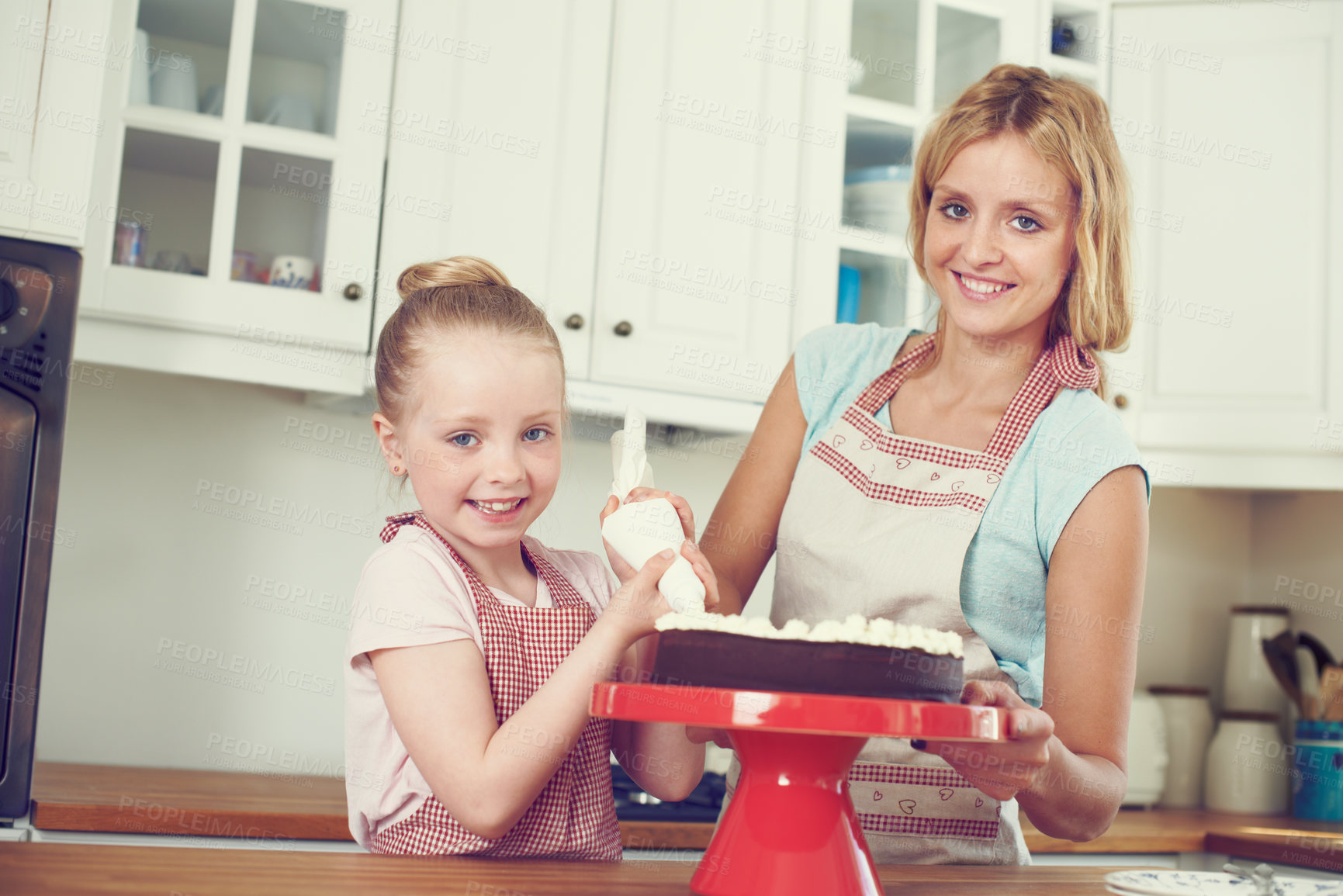 Buy stock photo Frosting, cake and portrait with mother and child in kitchen for baking, ingredients or recipe learning. Cooking, decoration and baker with girl and woman in family home for support, dessert and food