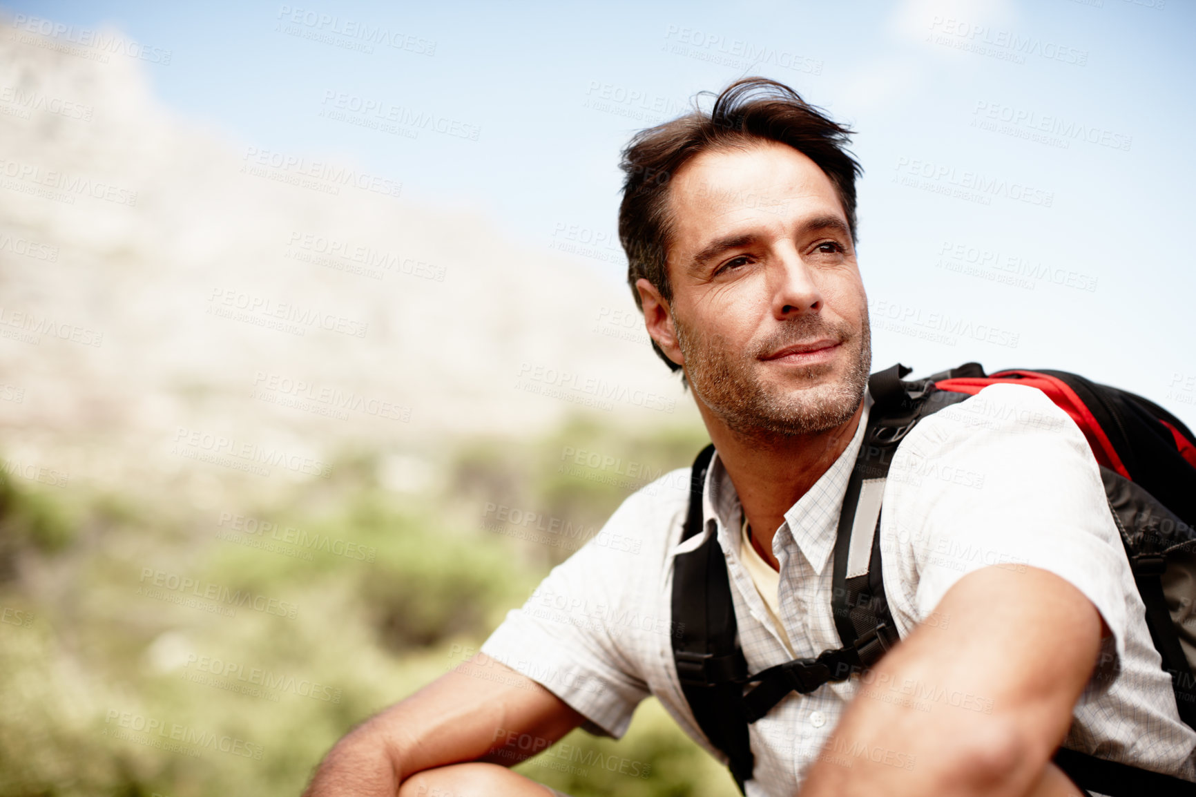 Buy stock photo Rest, hiking and man on mountain top with thinking, peace and fitness on holiday adventure for travel. Break, inspiration and calm hiker on hill with backpack, relax and outdoor vacation in nature.