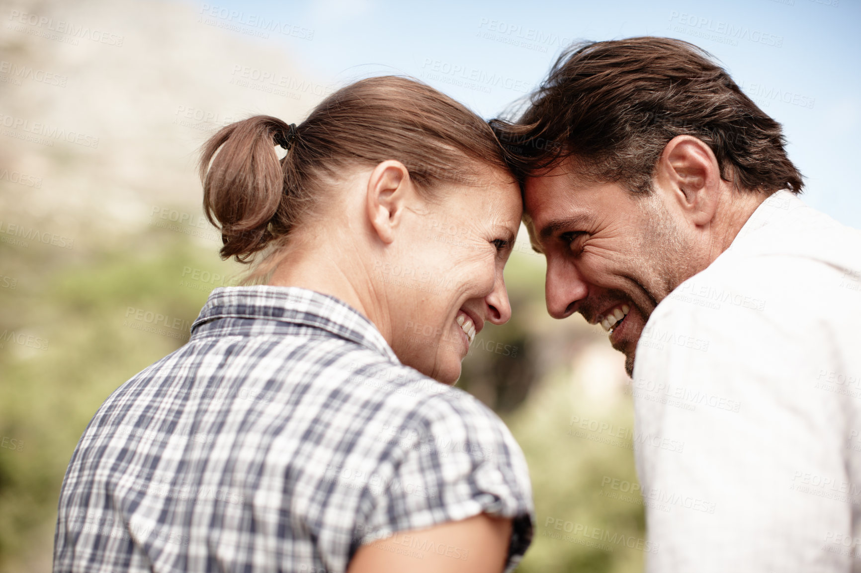 Buy stock photo Couple, forehead touch and outdoor vacation on mountain, love and bonding adventure in Costa Rica. Happy people, sustainable honeymoon and together on holiday, profile and weekend trip for connection