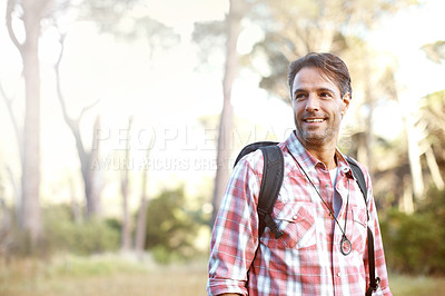Buy stock photo A handsome young man wearing a backpack outside