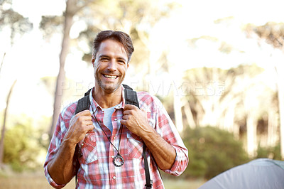 Buy stock photo Man, portrait and backpack by tent for camping, outdoor and smile with pride, adventure and journey in summer. Person, happy and bag with direction, travel and vacation with sunshine in Costa Rica