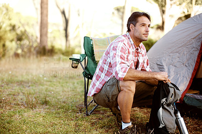 Buy stock photo Man, thinking and camping chair by tent, outdoor and perspective on adventure, journey or holiday in summer. Person, relax and remember on grass field for vacation, sunshine and nature in Argentina