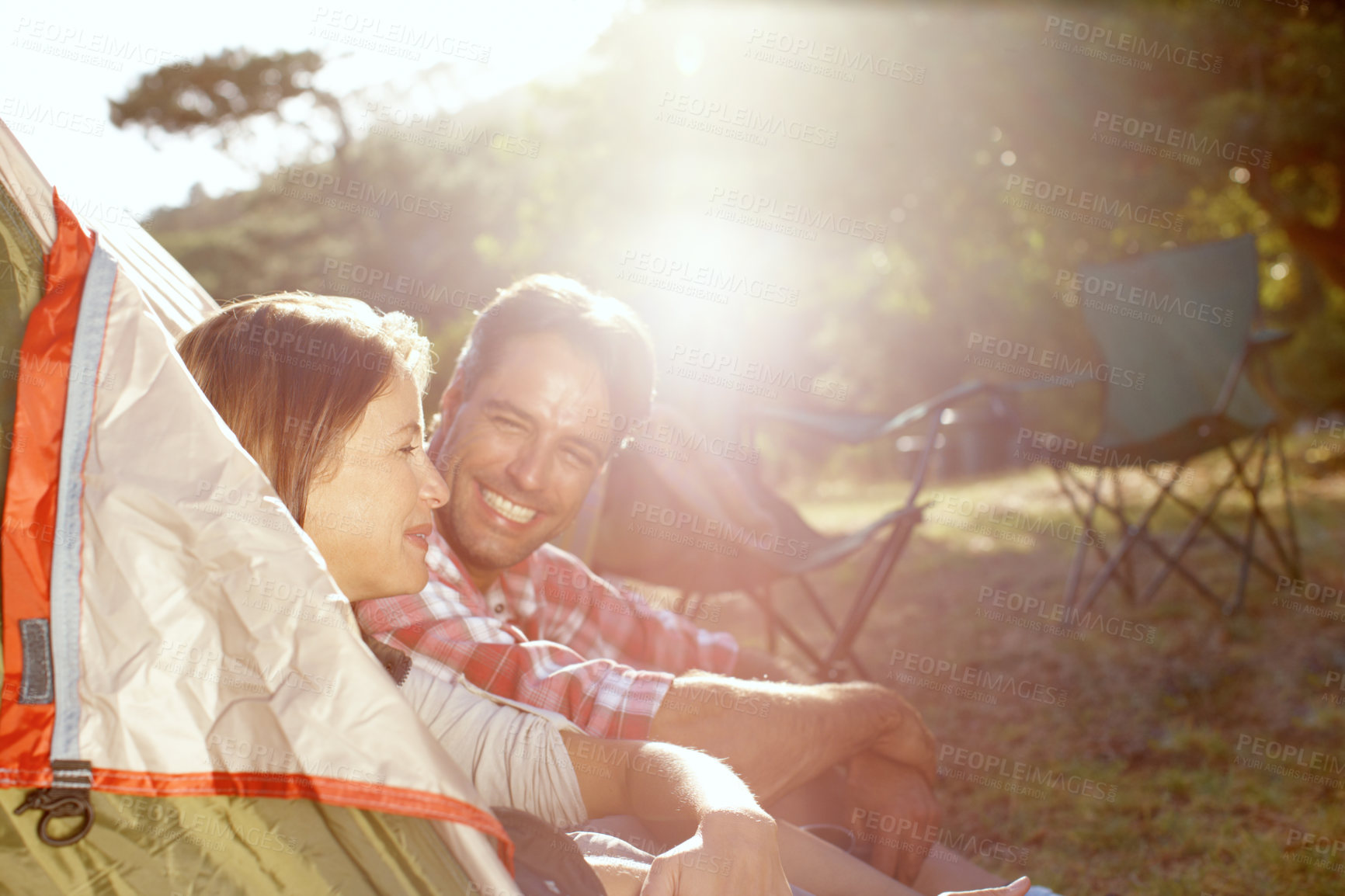 Buy stock photo A young couple enjoying their camping trip