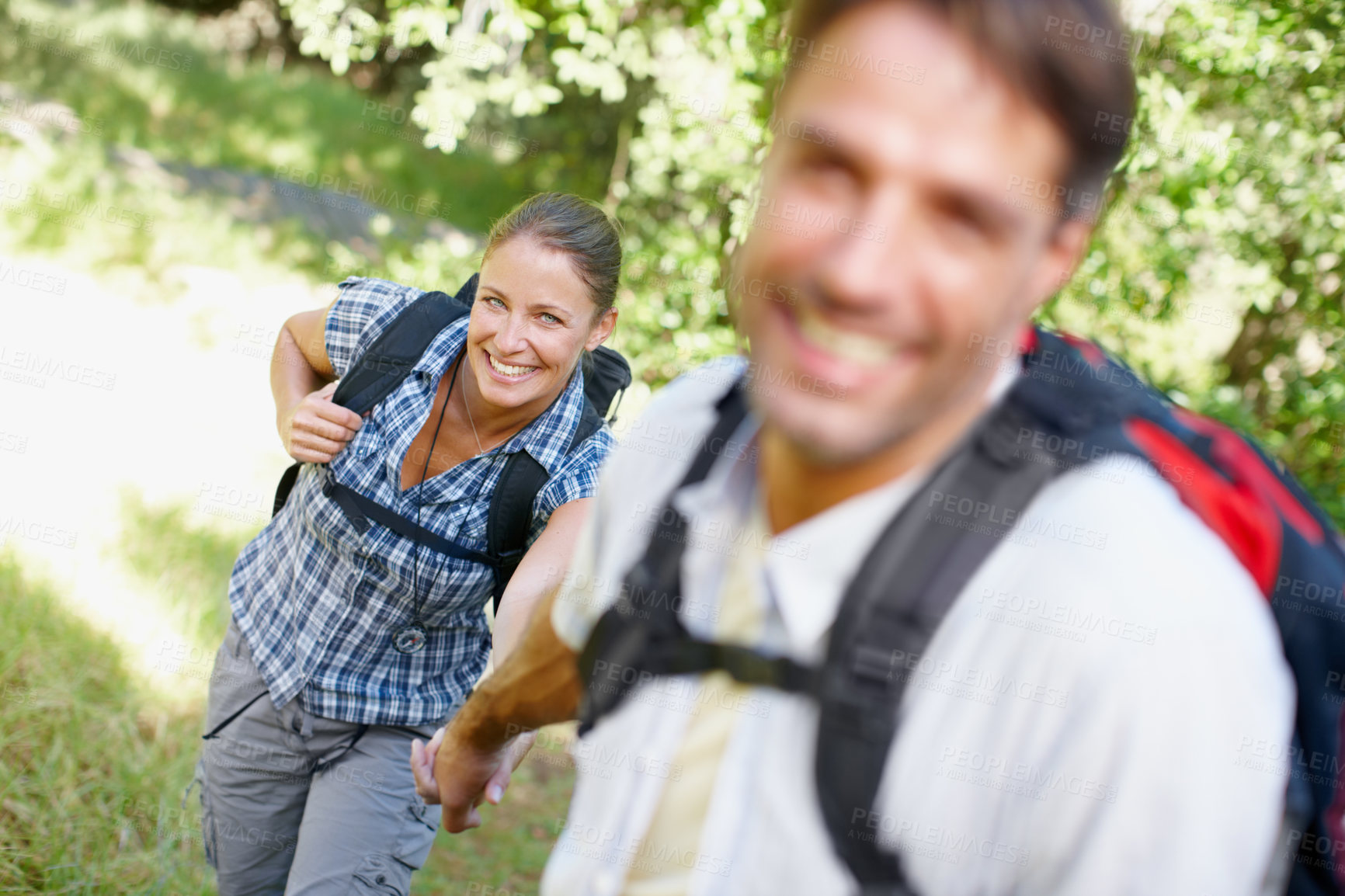 Buy stock photo Couple, portrait and holding hands in nature for hiking, fitness and adventure with bonding and support. Man, woman and love outdoor for exercise, health and trekking with journey, travel and walking