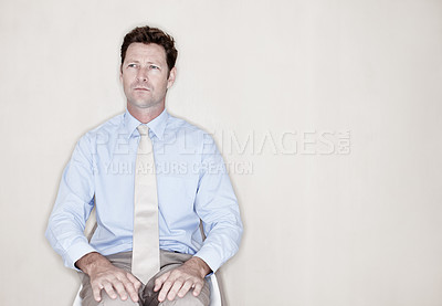 Buy stock photo Businessman, thinking and wait at studio mockup for business, recruitment or anxiety for interview. Corporate person, onboarding or decision at wall space for opportunity, choice or future in company