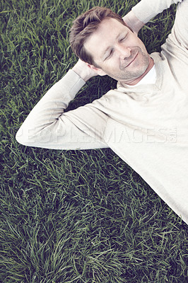 Buy stock photo Top view, man and sleeping on grass for peace, outdoor nature and travel to Florence countryside. Male person, eyes closed and rest in environment for wellness, garden health and dreaming in nap