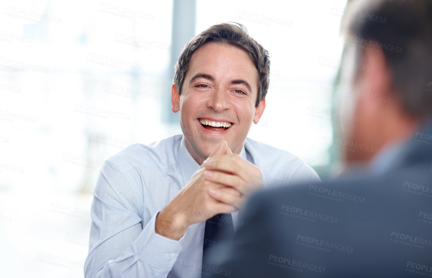 Buy stock photo Happy businessman, discussion or meeting with positive attitude for interview, business opportunity or idea at office. Excited man, employees or colleagues with smile for career growth or development