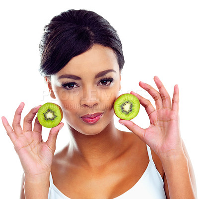 Buy stock photo Cropped portrait of a beautiful young woman holding kiwis