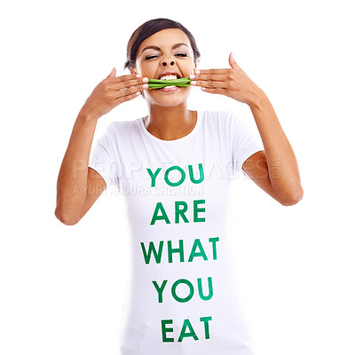 Buy stock photo Portrait of a young woman holding green beans while wearing a t-shirt saying 