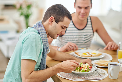 Buy stock photo Shot of a gay couple having lunch together