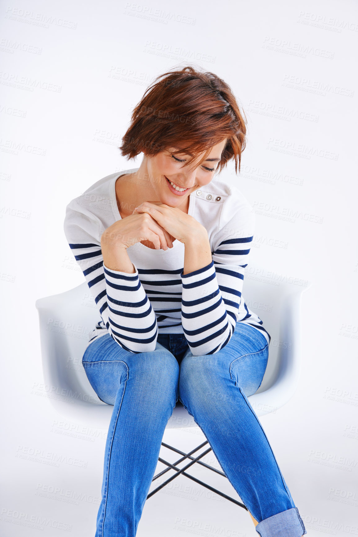 Buy stock photo Chair, calm and girl with smile in studio for fashion or sweater style, trendy outfit or jeans by white background. Laugh, relax and model for happiness, confidence or comfortable clothes on mockup