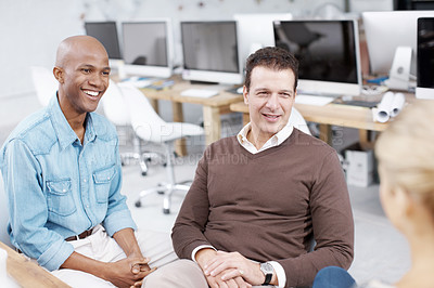Buy stock photo Three coworkers in an informal meeting together