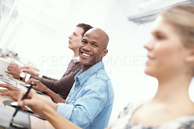 Buy stock photo Portrait of three coworkers working hard on the computers in the office