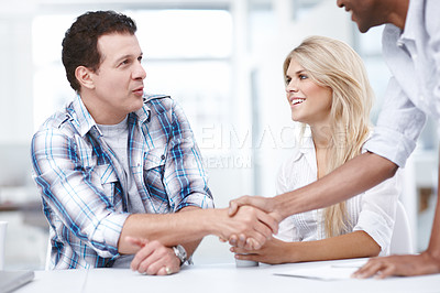Buy stock photo Close-up shot of a team of professionals congratulating each other
