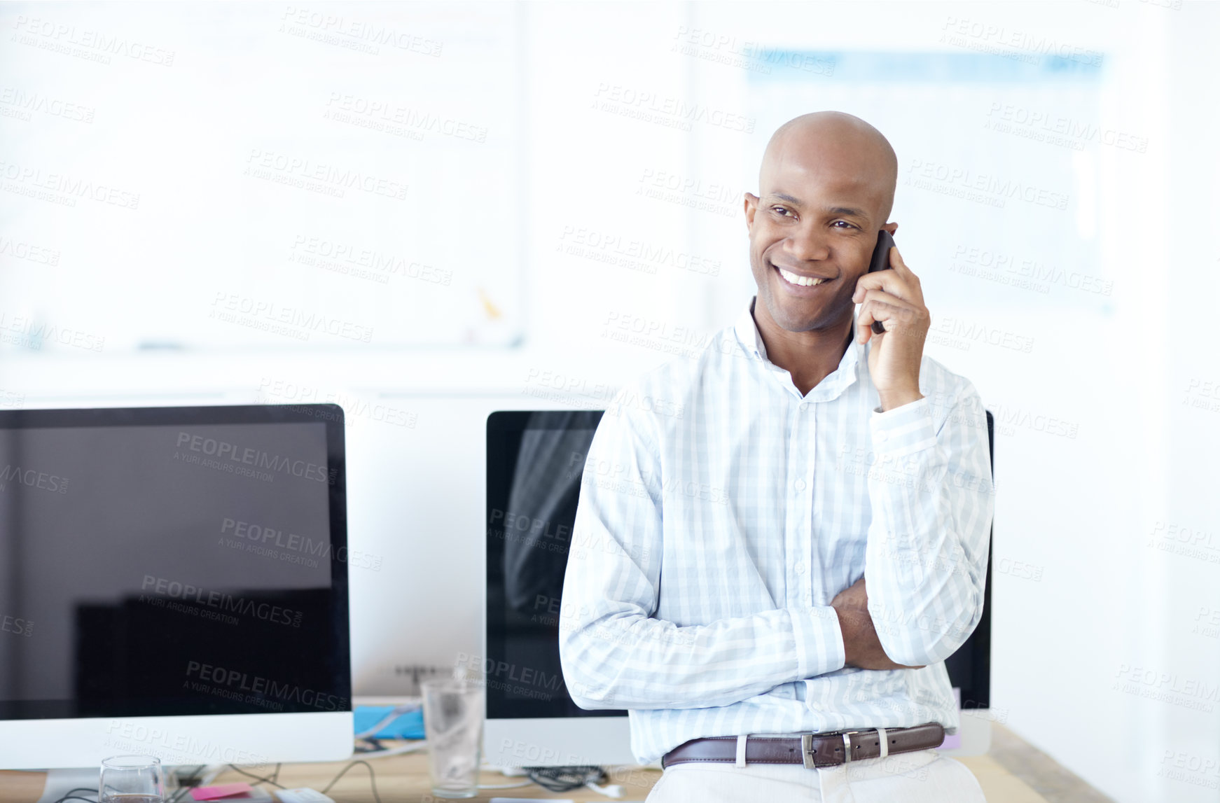 Buy stock photo Happy, black man and salesman with phone call for online advice, discussion or conversation at office. African, male person or consultant with smile on mobile smartphone for business chat or help