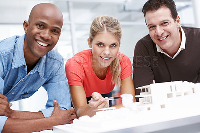 Buy stock photo Portrait of a team of architects working together on an architectural model