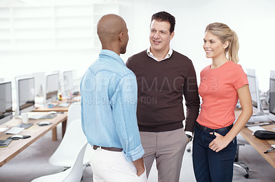 Buy stock photo Three businesspeople standing in the office