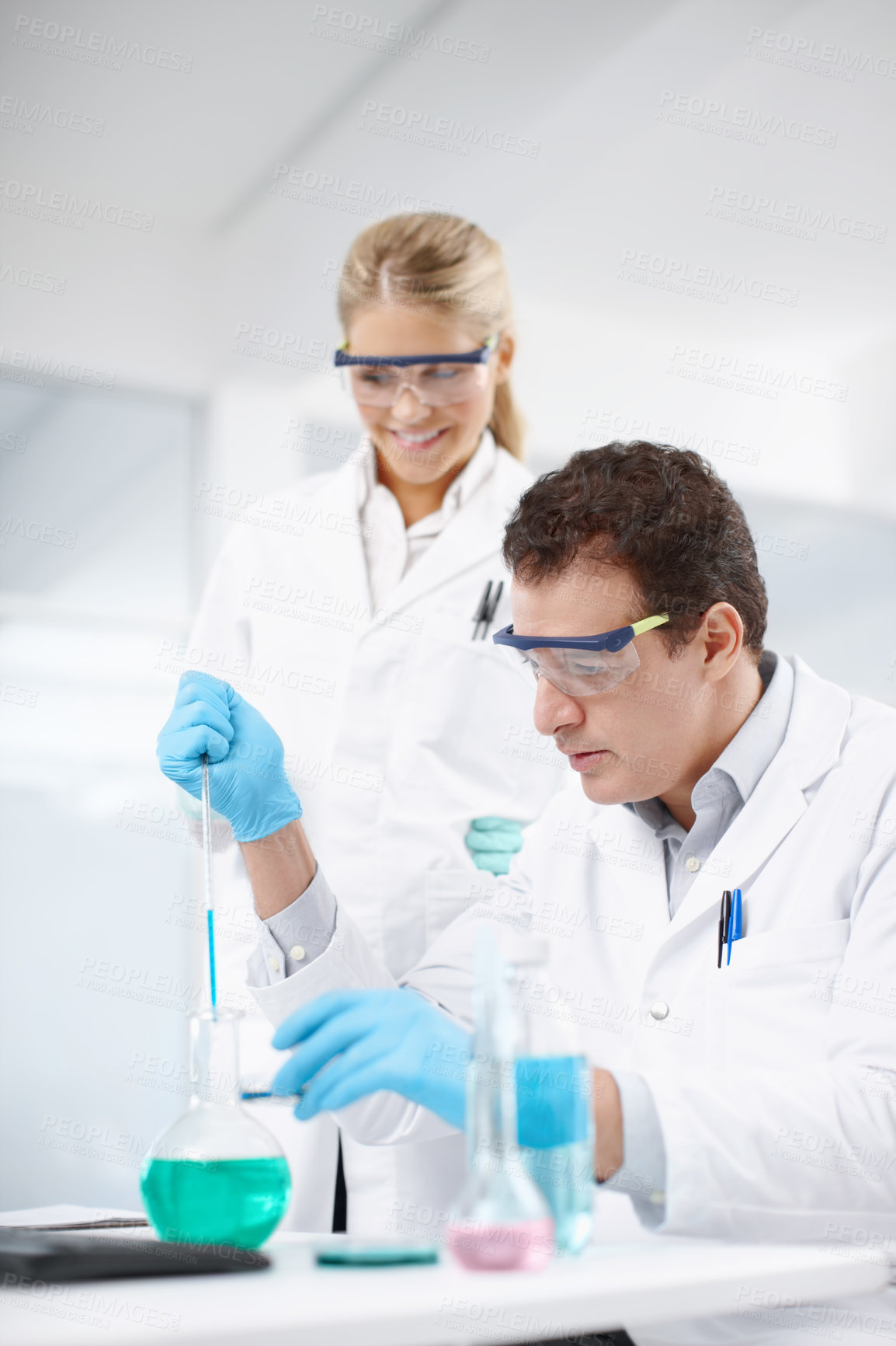 Buy stock photo Research, man and woman in laboratory with pipette, collaboration and technology in science study. Solution, scientist and medical team in biotech, pharmaceutical innovation or vaccine development