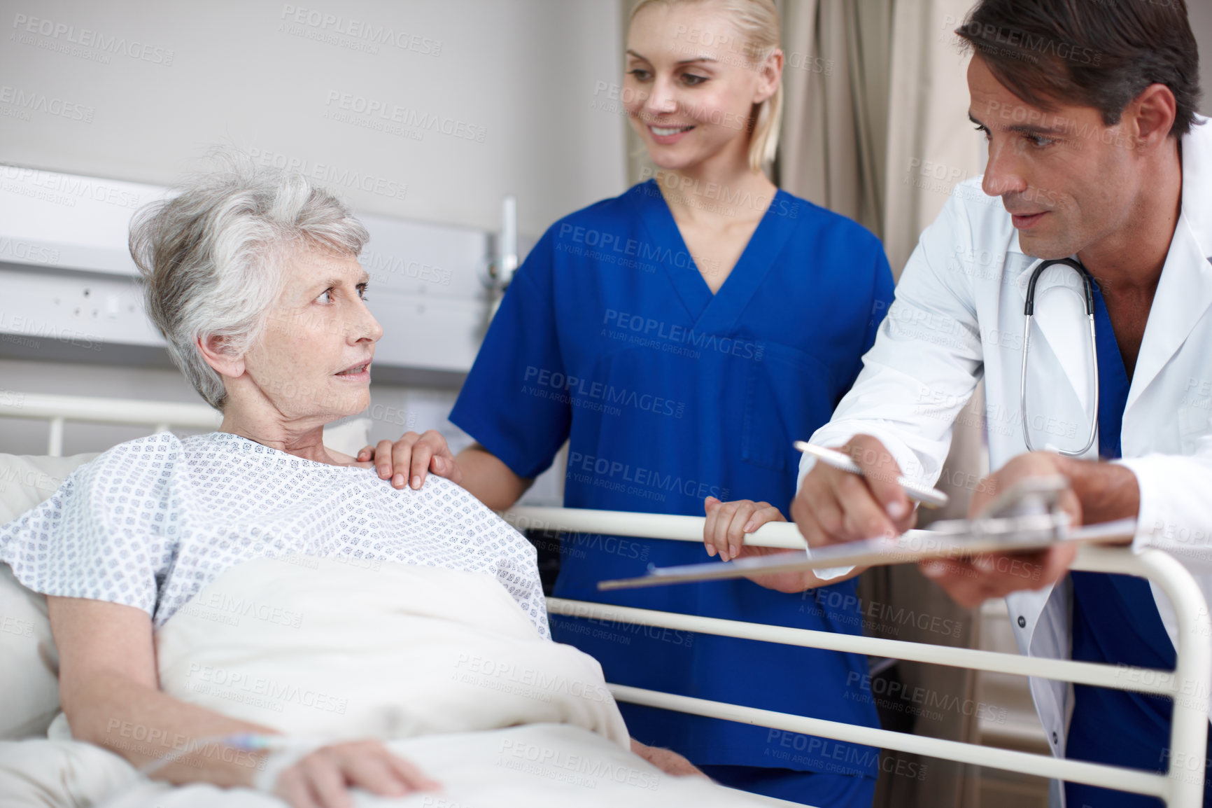 Buy stock photo Medical, team and elderly patient in hospital bed for healthcare results, surgery checkup and progress notes. Senior woman, nurse and doctor with clipboard in clinic for health support and recovery