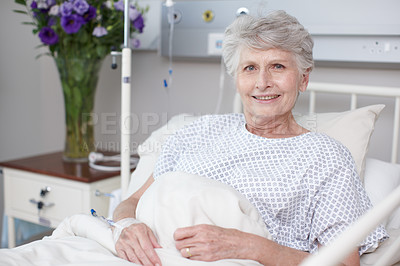 Buy stock photo Portrait of a senior woman lying in the hospital bed in her ward