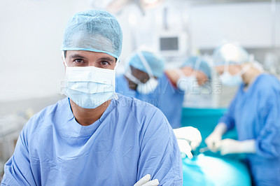 Buy stock photo Theatre, man and doctor in portrait with confidence, medical surgery and procedure for teamwork. Hospital, team leader and surgeon with pride for operating room, healthcare and face mask for safety
