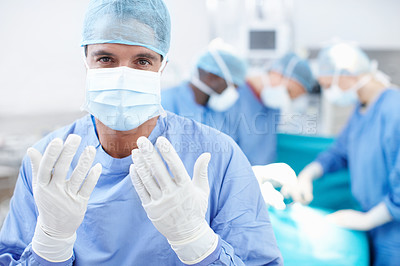 Buy stock photo Healthcare, surgery and portrait with man in hospital for doctor, operating room and emergency. Medical, organ transplant and teamwork with person in clinic for sterile, procedure and face mask