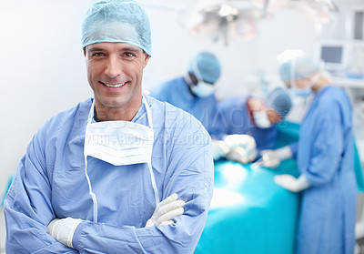 Buy stock photo Portrait of a happy, confident and professional doctor with his team of surgical experts behind him