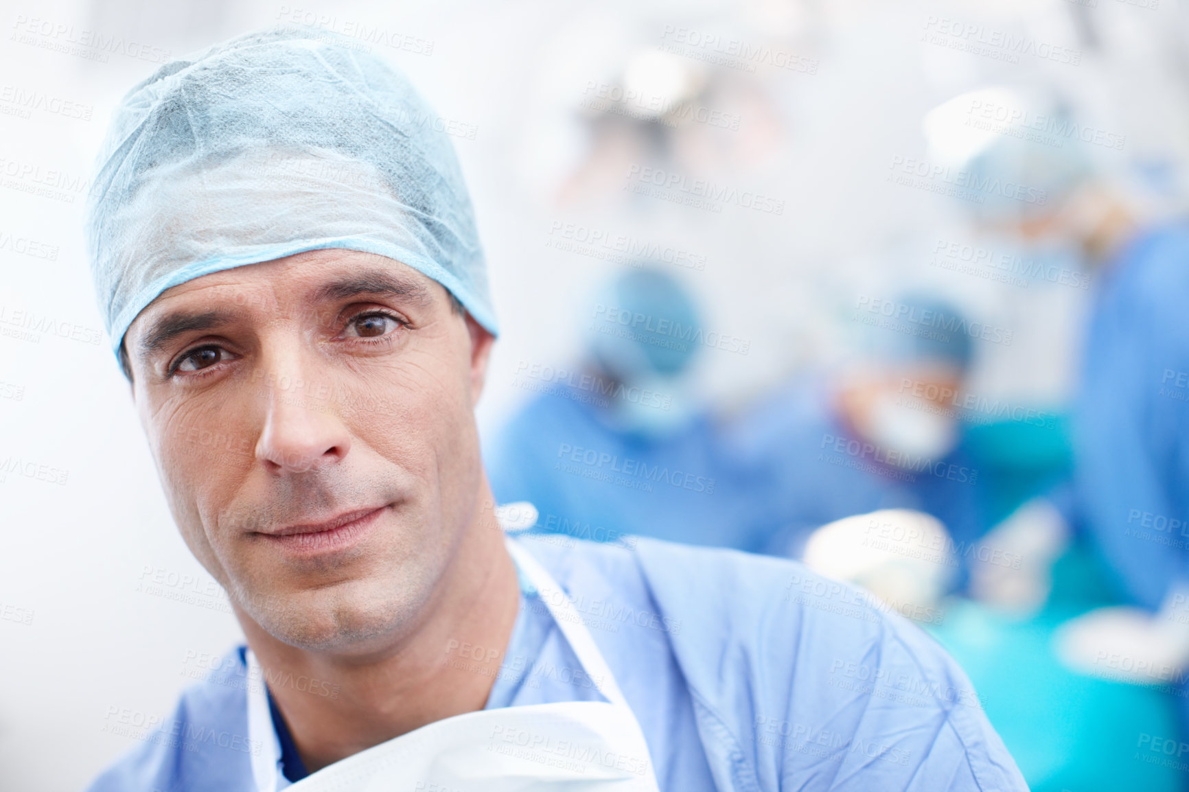 Buy stock photo Portrait, surgery and doctors with man in theatre for teamwork, operating room and emergency. Cardiology, organ transplant and hospital with person in clinic for healthcare, medical and pride