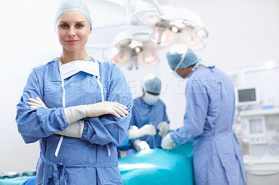 Buy stock photo Woman, doctor and portrait with smile for theater, medical surgery and procedure for staff. Hospital, team leader and surgeon with arms crossed for operating room, career and ppe uniform for safety