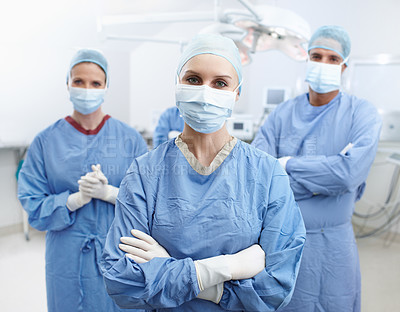 Buy stock photo Hospital, doctors and portrait with arms crossed for theater, medical surgery or procedure for staff. Teamwork, surgeons and woman leader with pride for operating room, clinic or face mask for safety