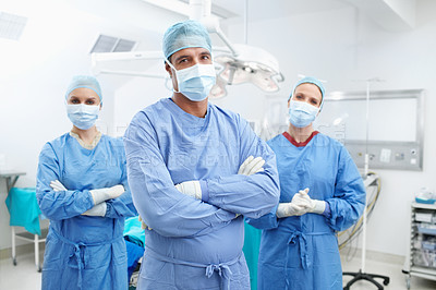 Buy stock photo Portrait of a confident and serious team of medical surgeons