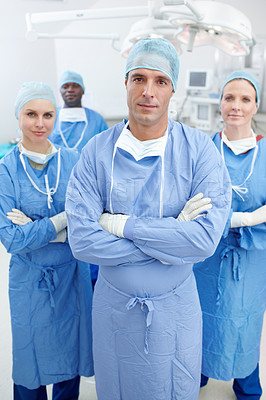 Buy stock photo Teamwork, doctors and smile in portrait for theater, medical surgery and procedure with confidence. Hospital, surgeons and man leader with arms crossed for operating room, clinic and ppe for safety